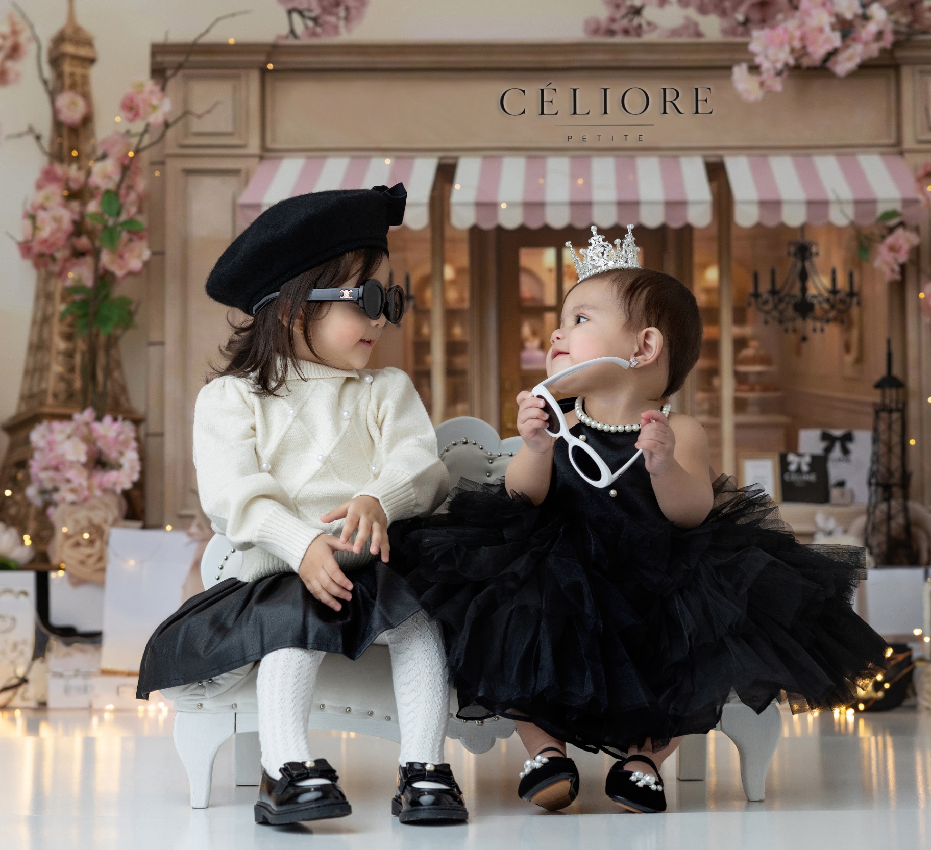 Two little sisters dressed in heirloom Céliore Petite styles